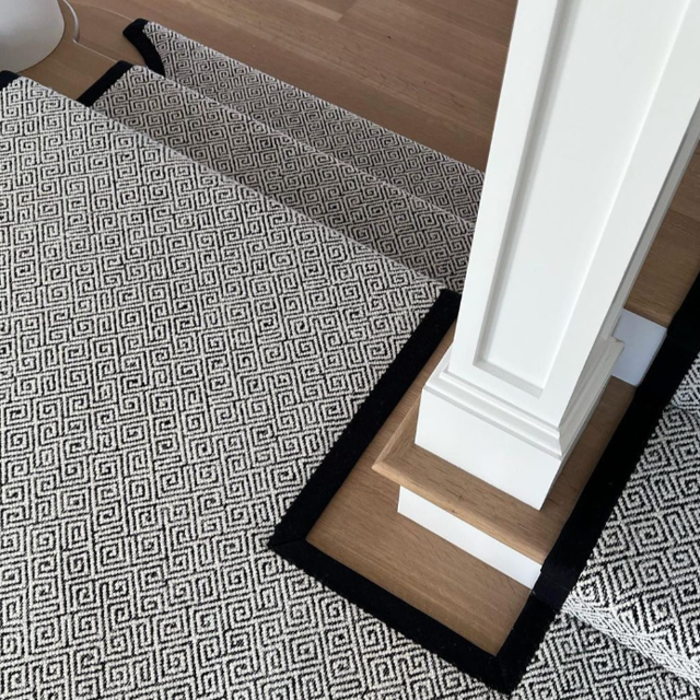 black and white patterned stair runner