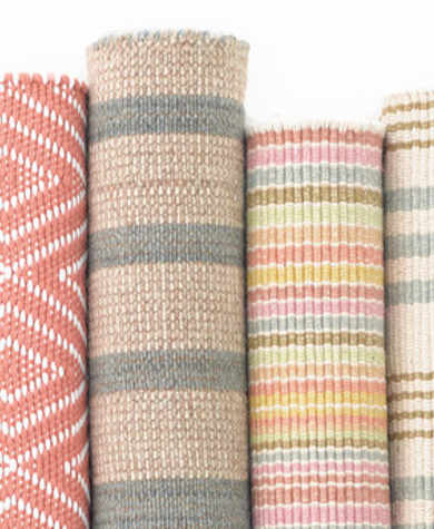 Rugs rolled up together